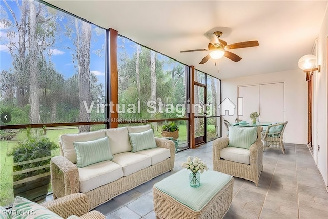 sunroom featuring ceiling fan