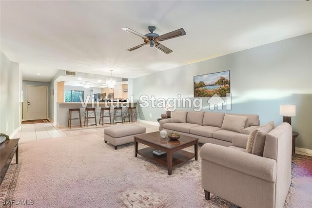 living room with ceiling fan and light carpet