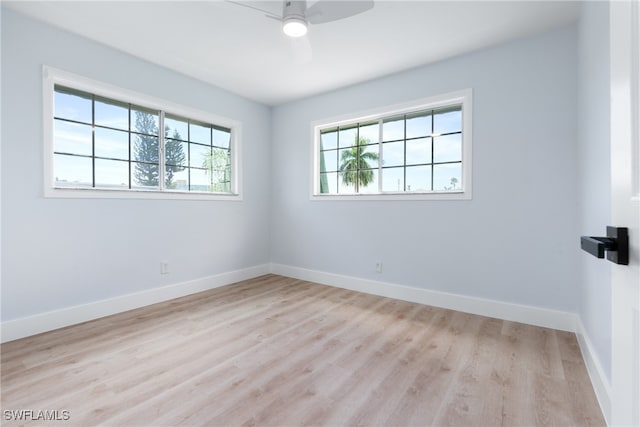 empty room with light hardwood / wood-style floors and ceiling fan