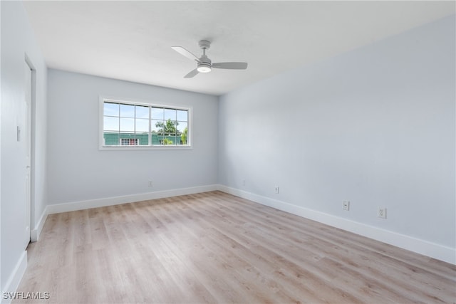 spare room featuring light wood-type flooring and ceiling fan