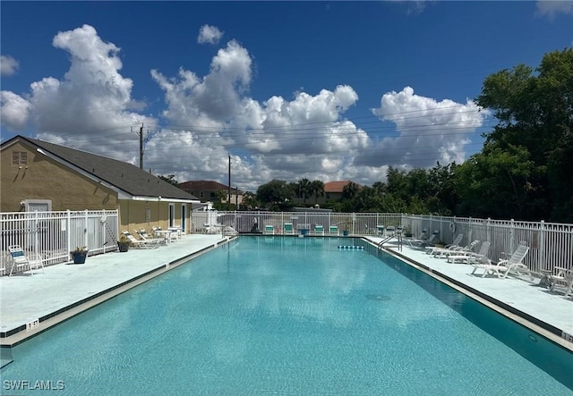 view of swimming pool with a patio