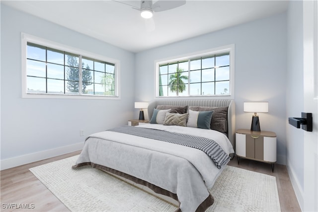 bedroom featuring light hardwood / wood-style flooring and ceiling fan