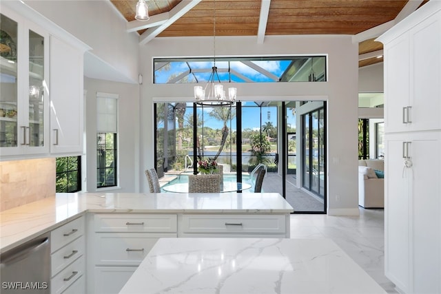 kitchen with pendant lighting, a notable chandelier, light stone countertops, wooden ceiling, and white cabinets