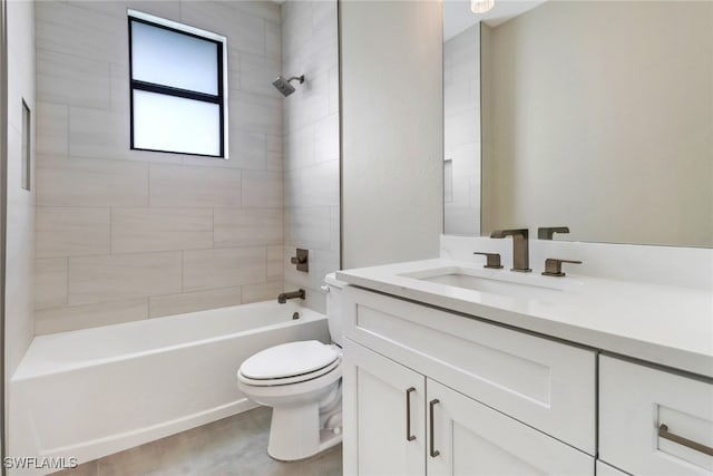 full bathroom with vanity, toilet, and tiled shower / bath