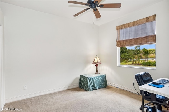 home office featuring carpet flooring and ceiling fan