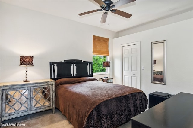 bedroom with a closet, ceiling fan, and carpet