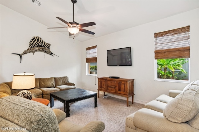 living room featuring light colored carpet and ceiling fan