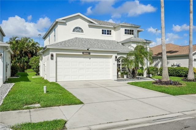 view of front of house with a garage and a front yard