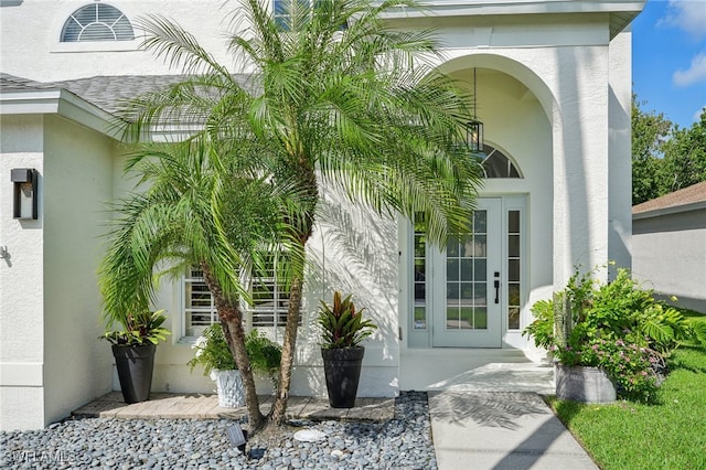 property entrance featuring french doors