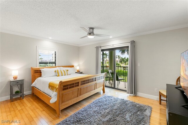 bedroom featuring access to exterior, light hardwood / wood-style floors, multiple windows, and ceiling fan