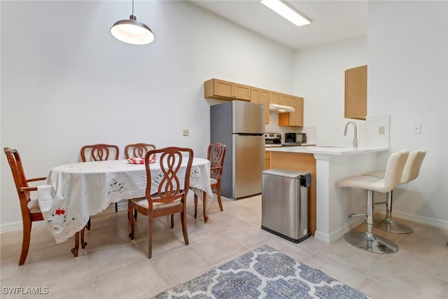 interior space featuring sink and light tile patterned floors