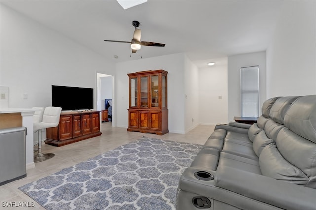 tiled living room with ceiling fan