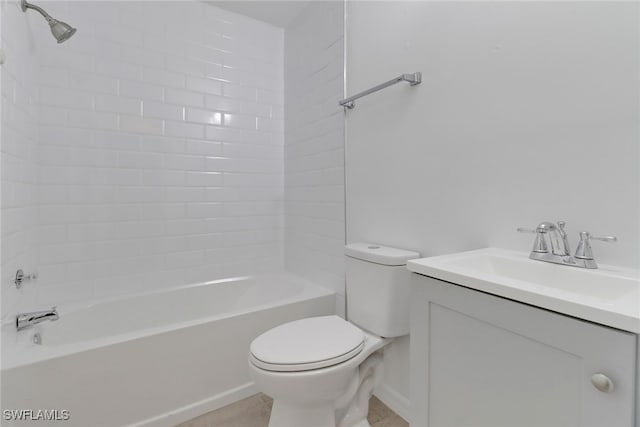 full bathroom featuring toilet, tiled shower / bath combo, and vanity