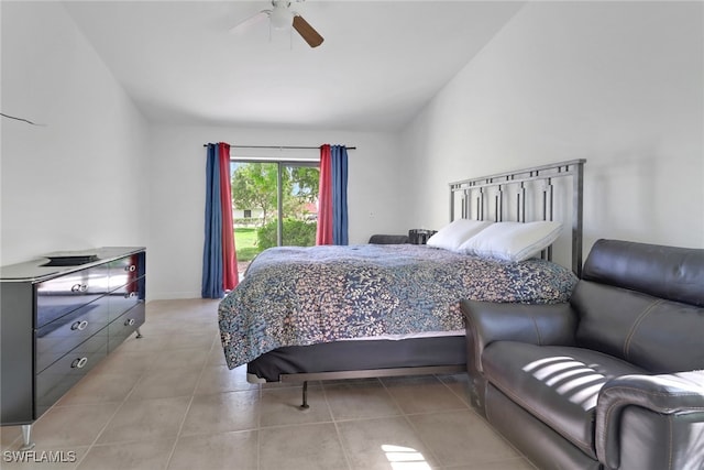 tiled bedroom featuring ceiling fan and vaulted ceiling