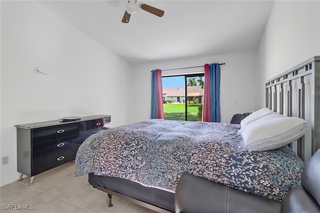 tiled bedroom with ceiling fan and access to outside