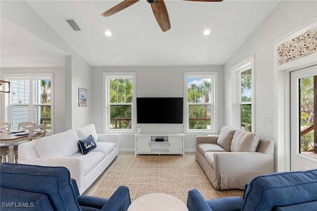 living area featuring vaulted ceiling, recessed lighting, baseboards, visible vents, and a ceiling fan