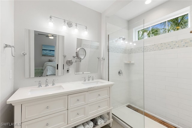 ensuite bathroom featuring ensuite bathroom, a walk in shower, and a sink