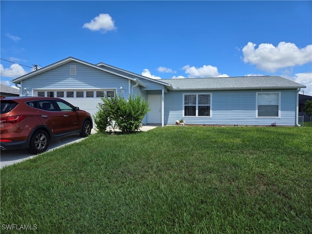 ranch-style house with a garage and a front lawn