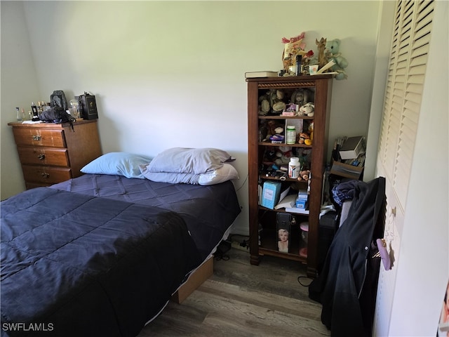 bedroom featuring dark hardwood / wood-style floors