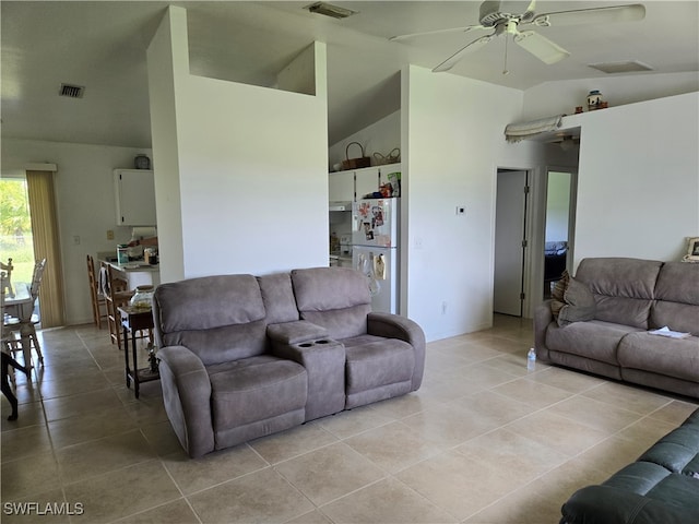 living room featuring high vaulted ceiling, ceiling fan, and light tile patterned floors