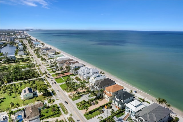 birds eye view of property with a view of the beach, a water view, and a residential view