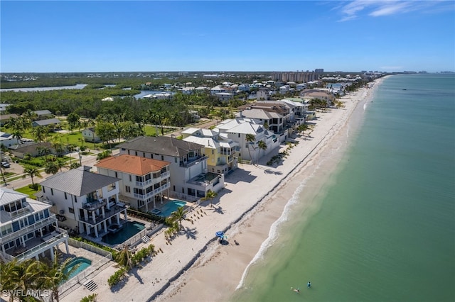 aerial view with a beach view, a residential view, and a water view