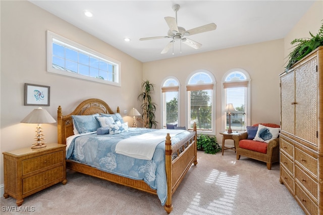 bedroom with ceiling fan, recessed lighting, and light colored carpet