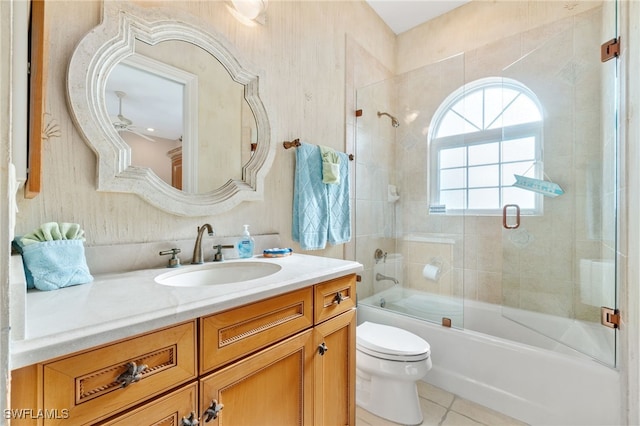 full bath with toilet, shower / bath combination with glass door, vanity, and tile patterned floors