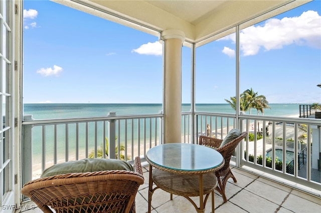 balcony with a view of the beach and a water view