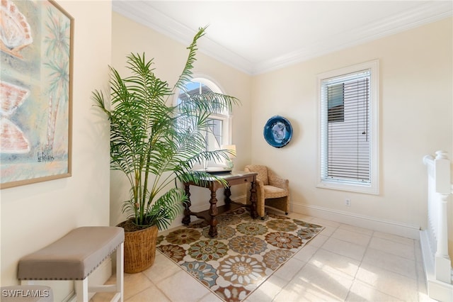 sitting room with crown molding, baseboards, and light tile patterned floors