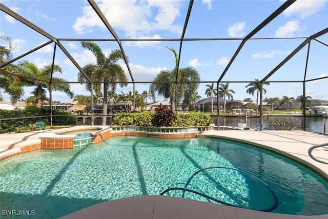 view of swimming pool with a water view, an in ground hot tub, a patio area, and glass enclosure