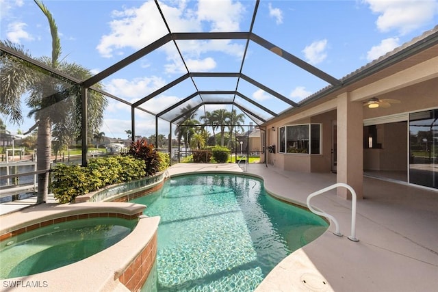 view of swimming pool with a patio, an in ground hot tub, ceiling fan, and glass enclosure