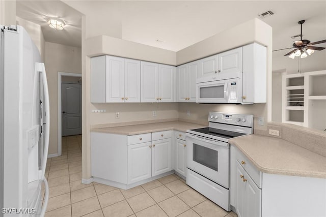 kitchen featuring white cabinetry, light tile patterned flooring, ceiling fan, and white appliances