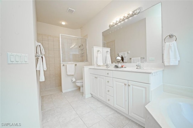 full bathroom featuring vanity, toilet, independent shower and bath, and tile patterned flooring