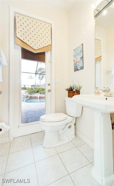 bathroom with tile patterned floors and toilet