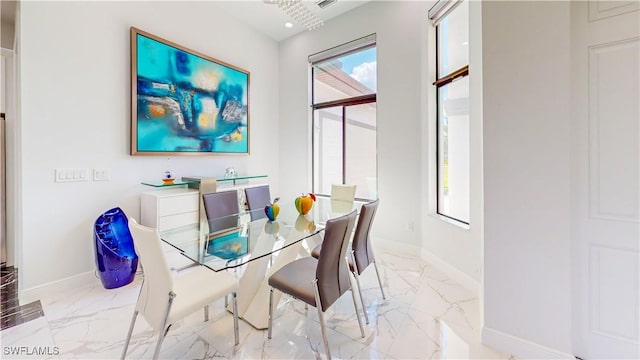 dining area with marble finish floor, recessed lighting, and baseboards