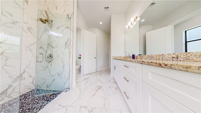 bathroom featuring a marble finish shower, visible vents, toilet, marble finish floor, and vanity