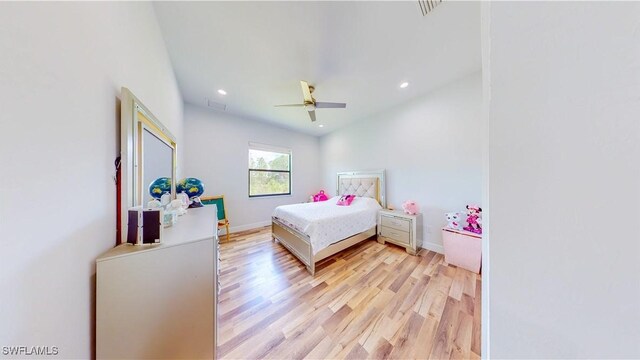 bedroom with ceiling fan and light hardwood / wood-style floors