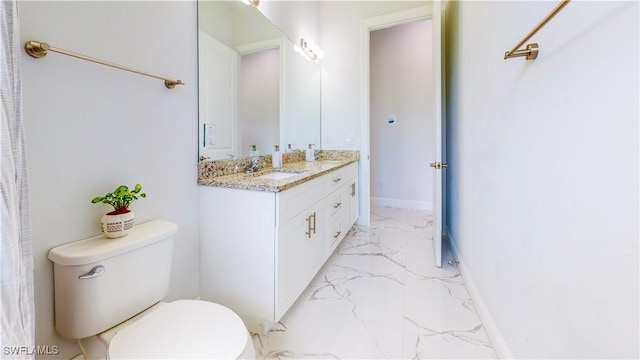 full bath featuring marble finish floor, vanity, toilet, and baseboards