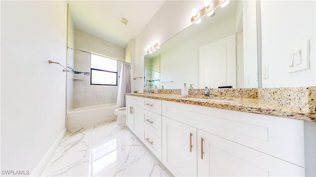 bathroom featuring marble finish floor, toilet, shower / tub combo, a sink, and baseboards