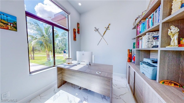 home office with marble finish floor and baseboards