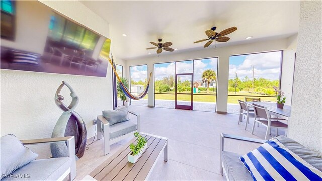 sunroom / solarium with ceiling fan