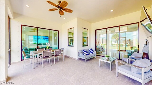 view of patio featuring ceiling fan