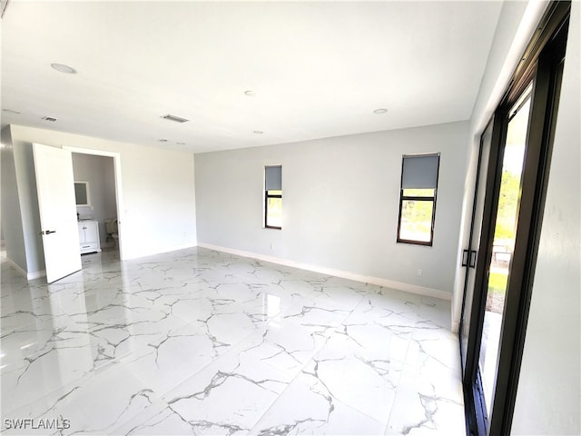 empty room with light tile patterned flooring