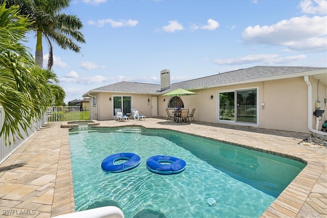 view of pool featuring a patio