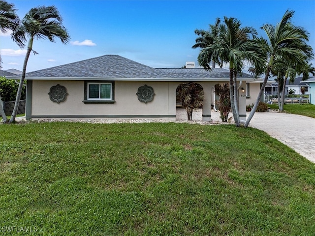 ranch-style house with a front yard