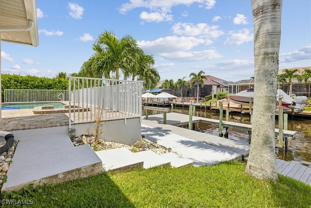 exterior space with a dock and a water view