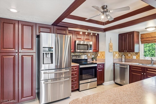 kitchen featuring appliances with stainless steel finishes, ornamental molding, tasteful backsplash, and sink