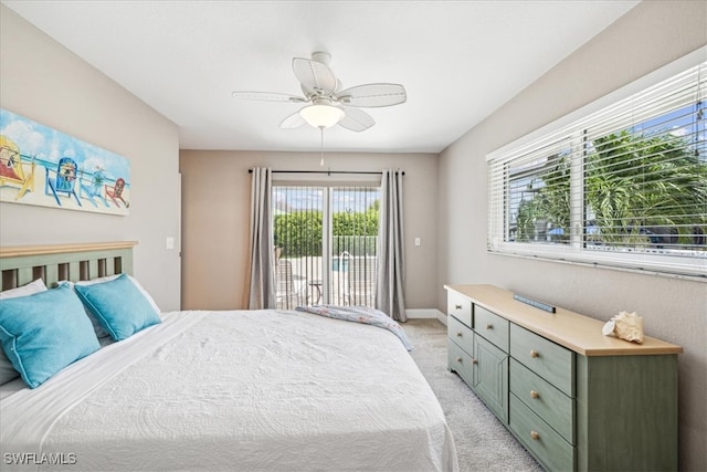 carpeted bedroom with multiple windows, access to exterior, and ceiling fan