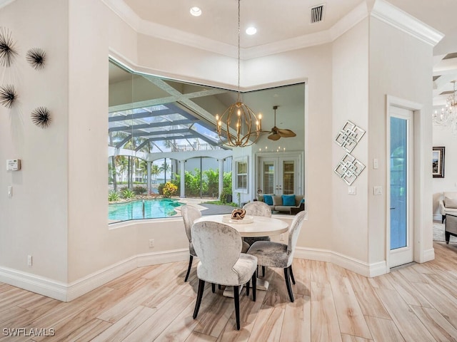 dining room with french doors, light wood-type flooring, and ornamental molding